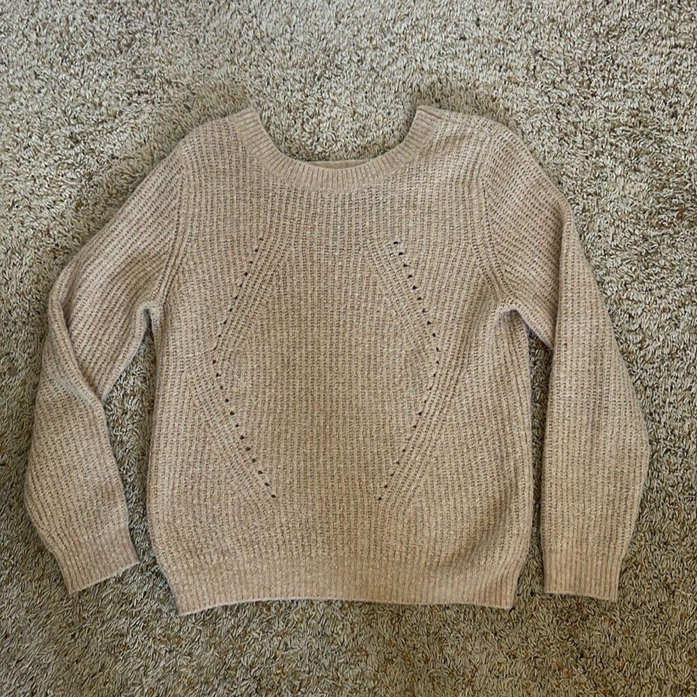 Light rose colored sweater with partially open back